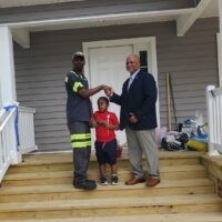 Chris shaking hands with Perry Hickmam