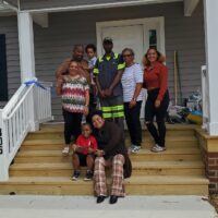 Chris and the Roman Family, Habitat Homeowners in Hanover Cove