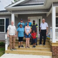 Chris with regular construction volunteers and board members