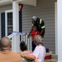 Chris and His Son After Cutting the Ribbon